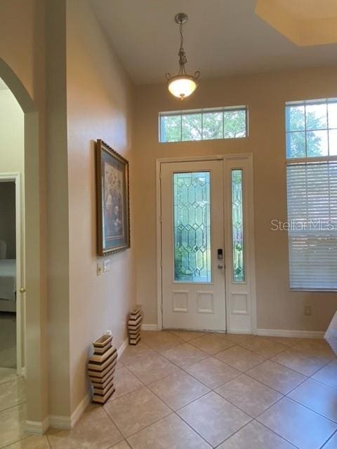 entryway featuring a healthy amount of sunlight and light tile patterned floors