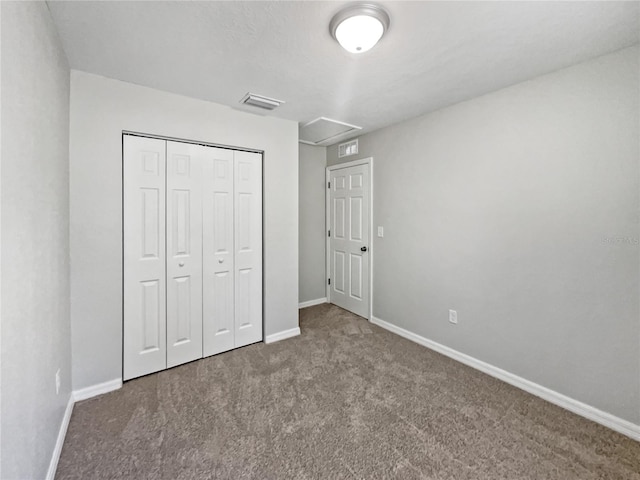 unfurnished bedroom featuring a closet and carpet