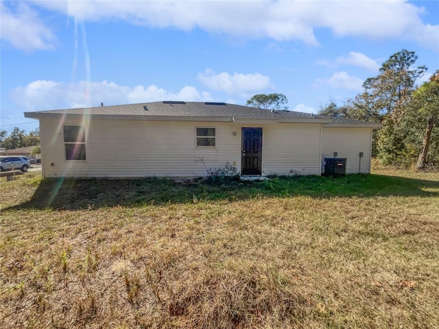 back of house with a yard