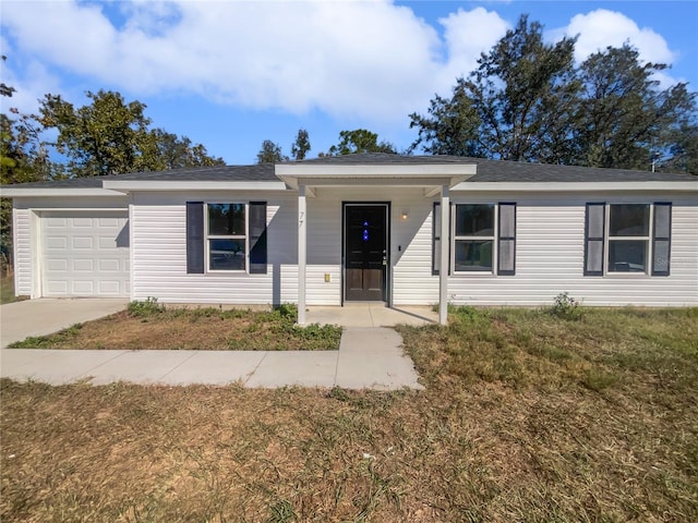 single story home with a front lawn and a garage