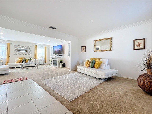 carpeted living room featuring a healthy amount of sunlight and ornamental molding