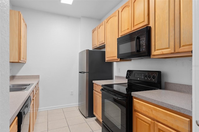 kitchen with light brown cabinets, light tile patterned flooring, black appliances, and sink