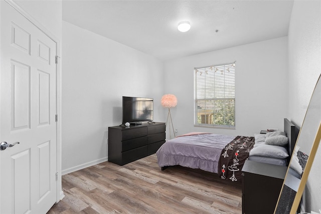 bedroom with light hardwood / wood-style flooring