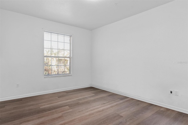 empty room featuring wood-type flooring