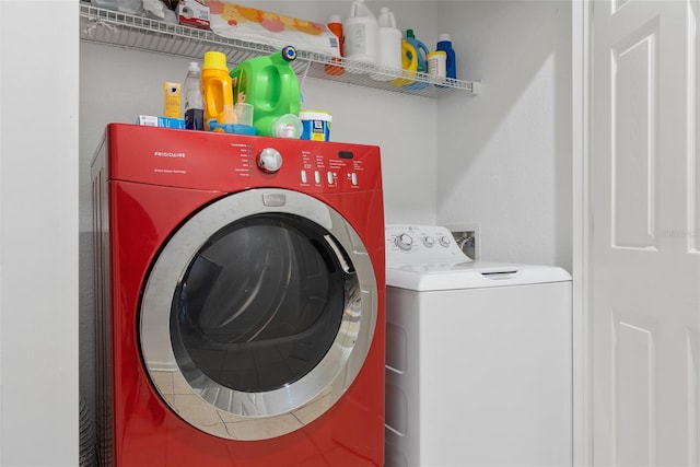 laundry room featuring washer and clothes dryer