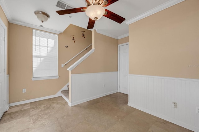 interior space with crown molding and ceiling fan