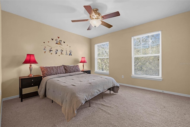 bedroom with light colored carpet and ceiling fan