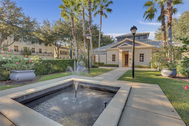 view of pool featuring a yard