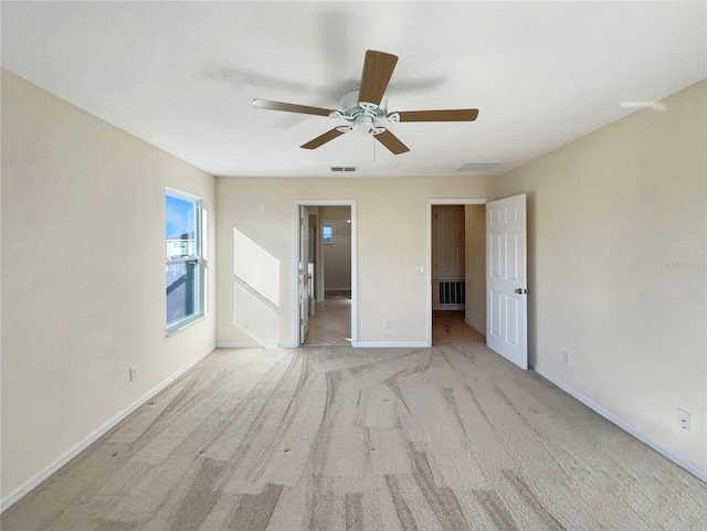 carpeted empty room with ceiling fan