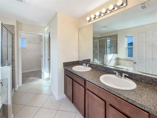 bathroom featuring tile patterned flooring, vanity, and independent shower and bath