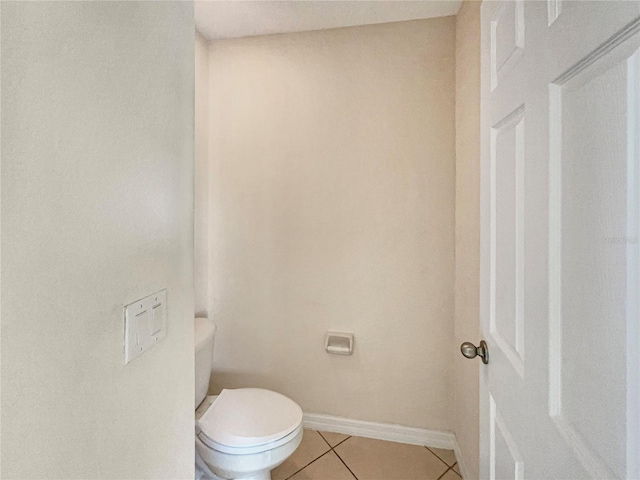 bathroom featuring tile patterned floors and toilet