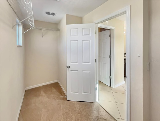 spacious closet with carpet floors