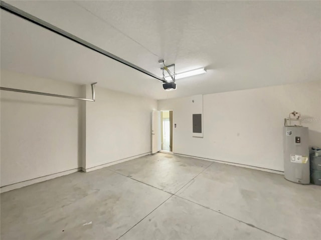 garage featuring electric panel, electric water heater, and a garage door opener