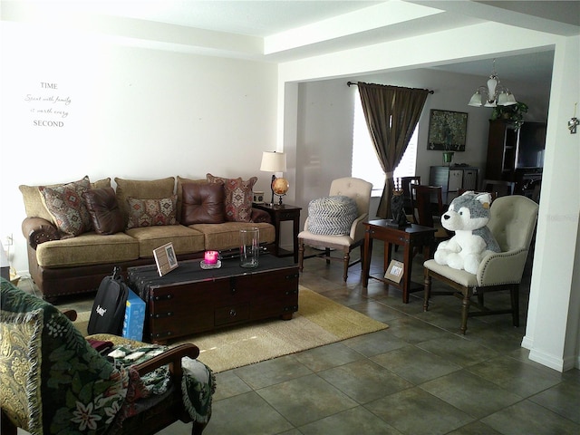 tiled living room with a chandelier