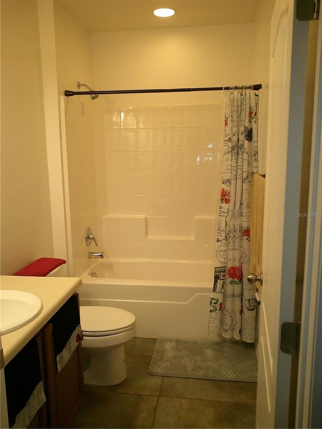 full bathroom featuring tile patterned flooring, vanity, toilet, and shower / bath combo with shower curtain