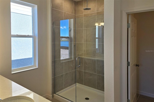 bathroom with vanity and an enclosed shower