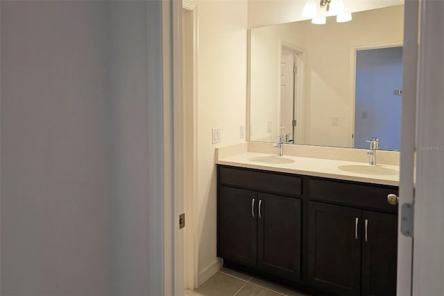 bathroom with tile patterned floors and vanity