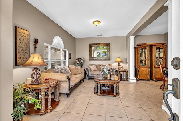 tiled living room featuring ornate columns