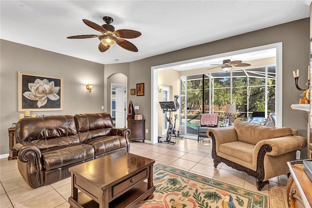 tiled living room featuring ceiling fan