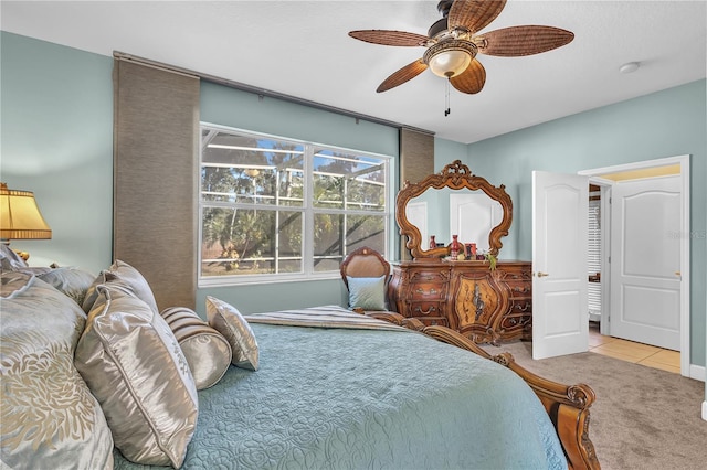 carpeted bedroom with ceiling fan