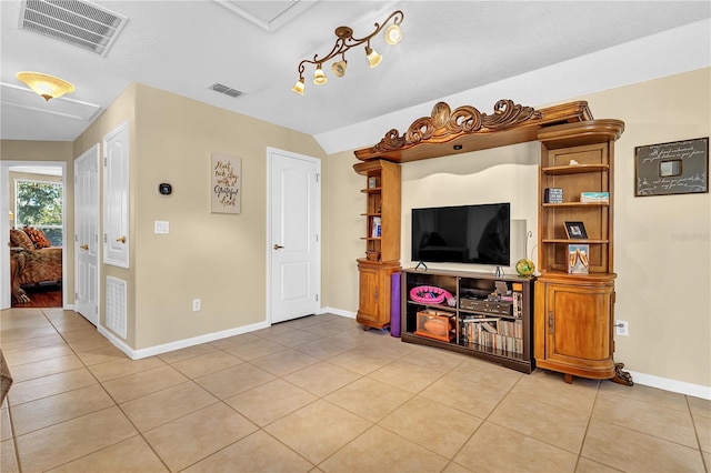 tiled living room with vaulted ceiling