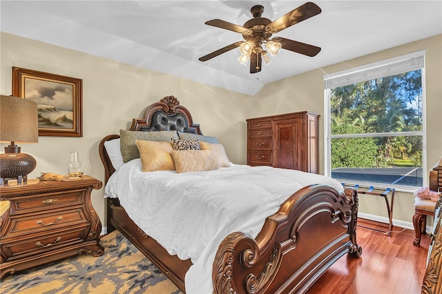 bedroom with hardwood / wood-style flooring and ceiling fan