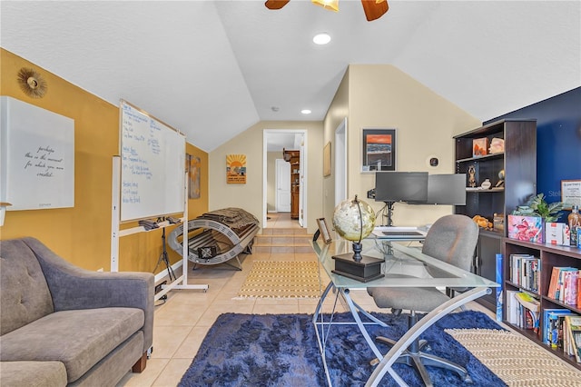 office space featuring ceiling fan, light tile patterned flooring, and lofted ceiling