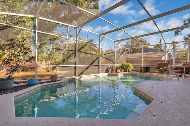 view of pool featuring a patio area and a lanai