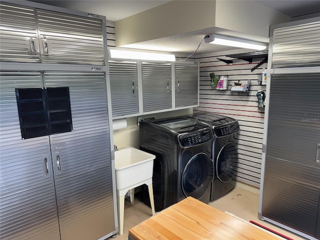 clothes washing area featuring washing machine and dryer