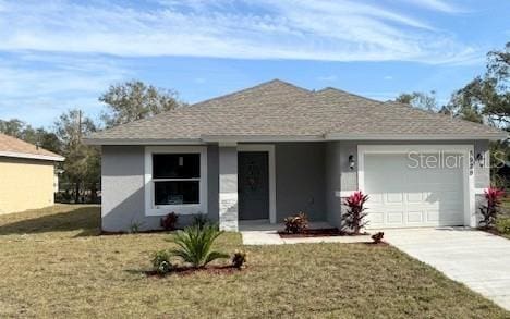 ranch-style home with a garage and a front yard