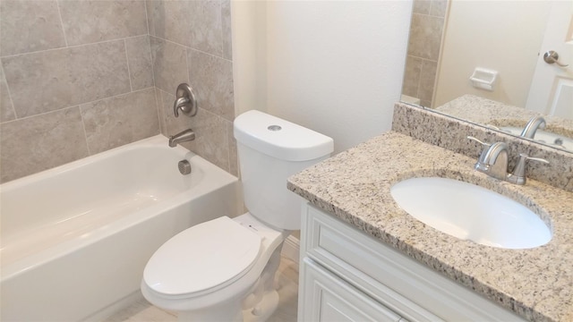 full bathroom with toilet, vanity, and tiled shower / bath