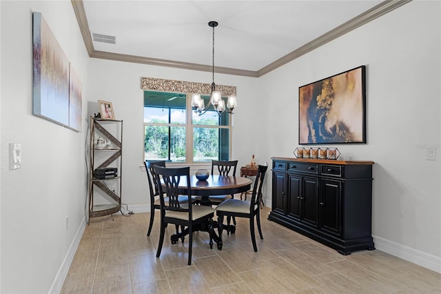 dining space featuring a chandelier, visible vents, crown molding, and baseboards