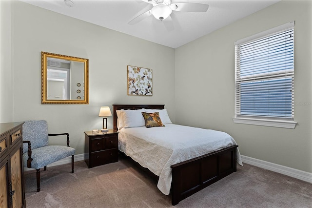 bedroom with carpet floors, baseboards, and a ceiling fan