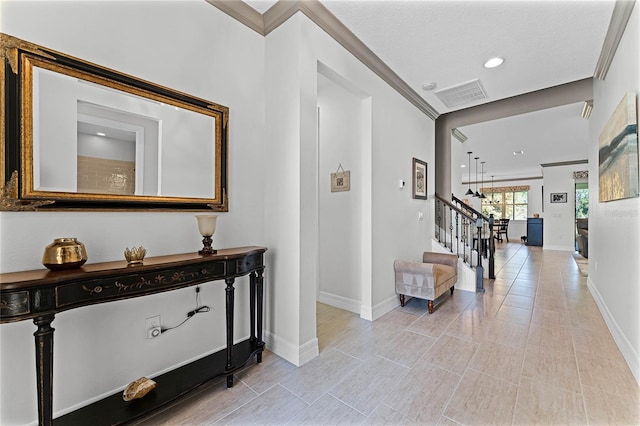 hallway with stairs, recessed lighting, visible vents, and baseboards