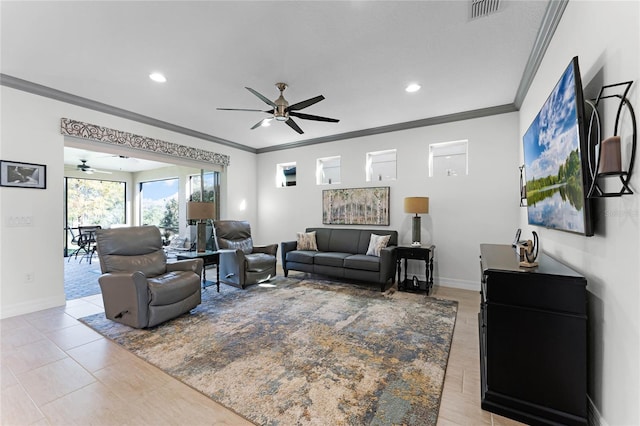 living room featuring visible vents, crown molding, baseboards, and ceiling fan