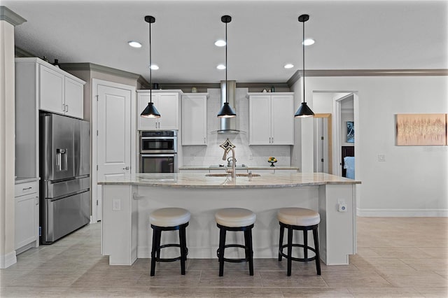 kitchen featuring stainless steel appliances, backsplash, a kitchen island with sink, white cabinets, and wall chimney exhaust hood