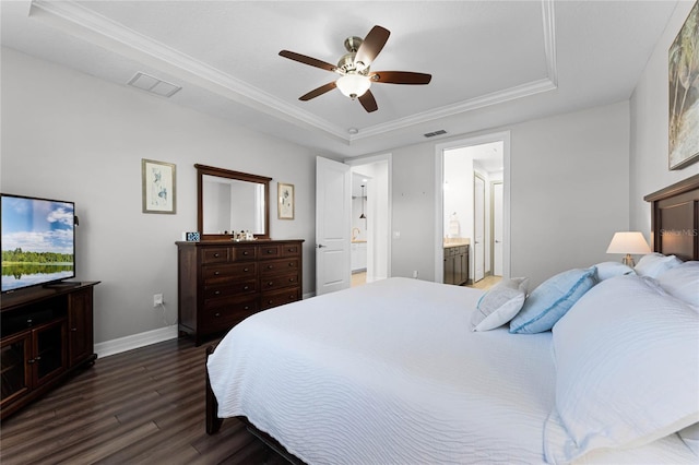 bedroom with visible vents, baseboards, a raised ceiling, and dark wood-type flooring