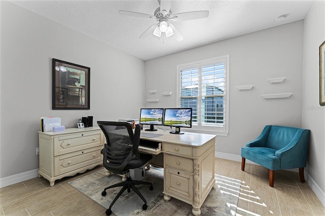 office with wood finish floors, ceiling fan, a textured ceiling, and baseboards