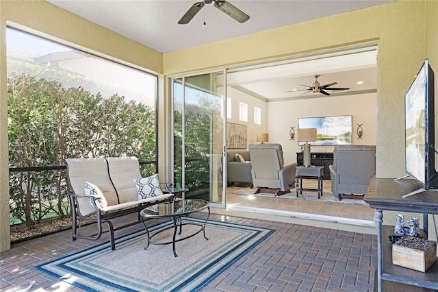 sunroom with a ceiling fan