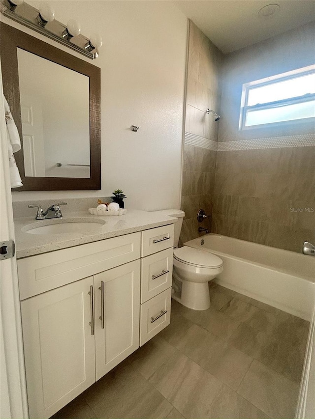 full bath with toilet, vanity, and bathing tub / shower combination