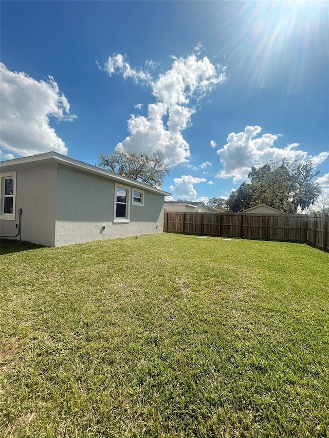 view of yard featuring fence