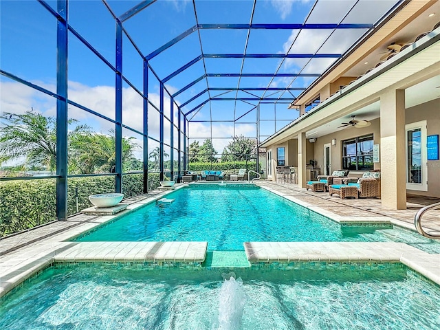 view of swimming pool featuring an outdoor living space, a patio, ceiling fan, and a lanai