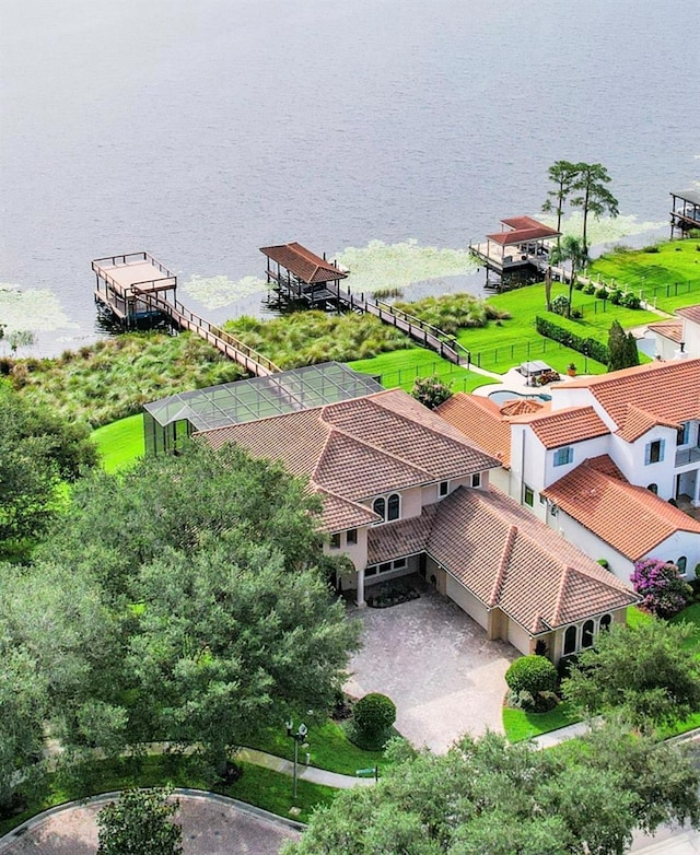 birds eye view of property with a water view