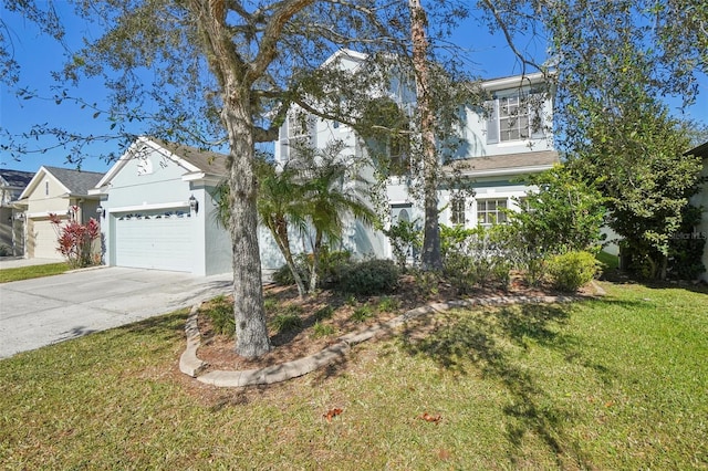 view of front of property with a garage and a front lawn