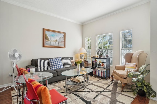 living room with light hardwood / wood-style flooring and ornamental molding