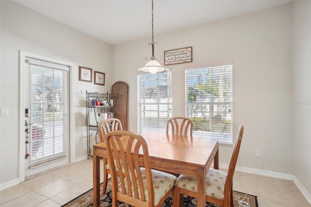 dining area featuring light tile patterned floors and plenty of natural light