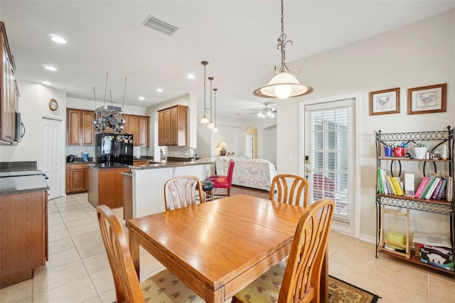 dining room featuring ceiling fan and light tile patterned floors