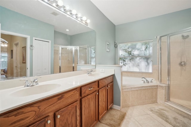 bathroom with vanity, tile patterned floors, and separate shower and tub