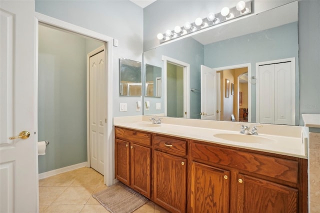 bathroom featuring tile patterned flooring and vanity