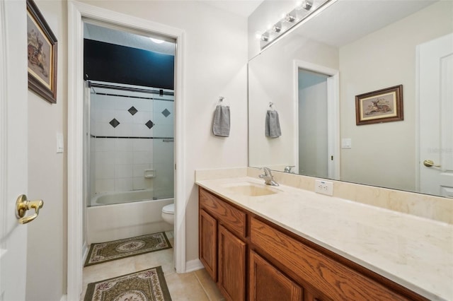 full bathroom featuring tile patterned flooring, vanity, tiled shower / bath combo, and toilet